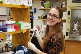 Mol Gen graduate student working at her lab station